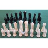 A set of back gloss and white gloss glazed ceramic chessmen.