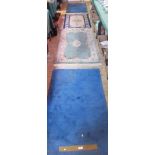 Two Chinese wool pile rugs, together with a pair of blue ground Chinese rugs,