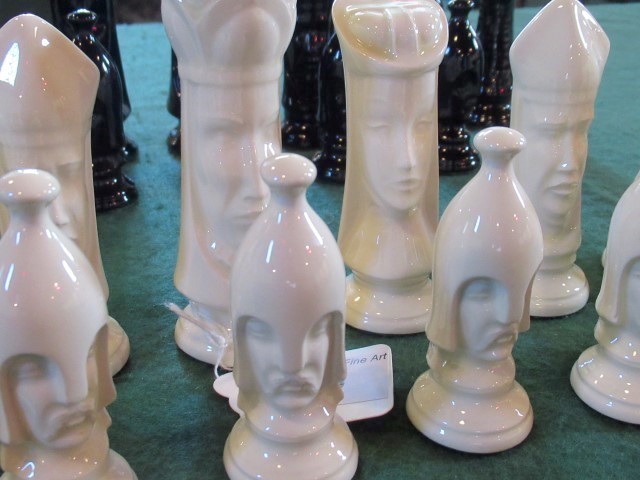 A set of back gloss and white gloss glazed ceramic chessmen. - Image 2 of 2