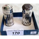 a pair of late Victorian silver cased peppers, each with blue glass liner, London 1894.