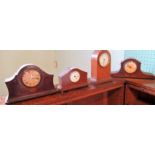 Three Edwardian mahogany mantle clocks, one of Lancet form.