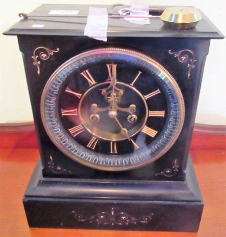 A 19th century French black slate mantle clock, with eight day movement,