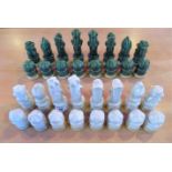 A set of green and white matt glazed chessmen.