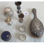 A silver backed brush, a cut glass dressing table pot with silver cover, two silver serviette rings,