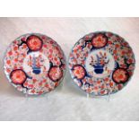 A pair of late 19th century Japanese Imari scallop edge plates,