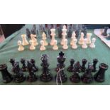 A set of white and ebonised resin moulded chessmen of Staunton design.