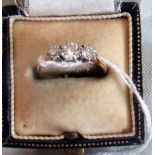 A three stone half-hoop diamond ring,