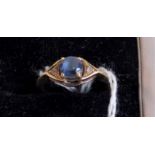 A sapphire and diamond three stone half-hoop ring,