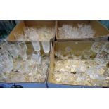 Four boxes of largely cut glass, various, including: red and white wine, brandy balloons,