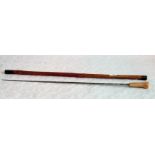 An Edwardian sword stick with indistinctly inscribed lozenge section steel blade,