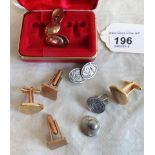 A pair of gold cufflinks, a pair of silver cufflinks and others.