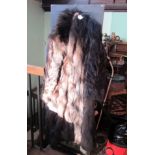 A lady's full length fur coat.