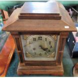 An Edwardian mantle clock, the architectural case enclosing an eight day movement,