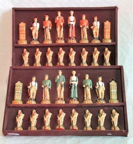 A boxed set of resin moulded chess pieces, of golfing interest, the pawns as caddies,