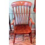 A 19th century beech and elm lathe back Windsor armchair.