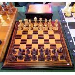 A set of carved amboyna and boxwood chessmen of Staunton design,