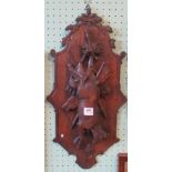 A 19th century, probably Black Forest hunting lodge relief plaque of cartouche form,