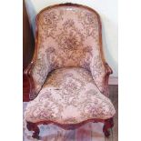 A Victorian walnut parlour armchair, having spoon back, scrolled arms,