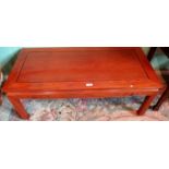 A 20th century Chinese hardwood coffee table.