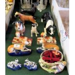 Two pairs of reproduction Staffordshire-type book stand, an unmarked ceramic model of a boxer dog,