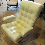 A 1970's vintage chromium plated and deep buttoned hide upholstered swivel chair.