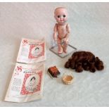 J D Kestner, a porcelain headed doll, mould number 221 with jointed composition body and limbs,