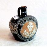 A Doulton Lambeth whisky flask for Grant MacKay & Co.