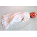 An Armand Marseille composition headed doll, 16 inch, with sleeping eyes and open mouth,