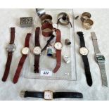 A collection of mid-20th century and other wristwatches, thimbles, a white metal matchbox case,