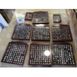 A large collection of approximately 800 assorted thimbles, in nine display cases, some loose.