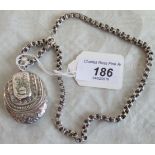 An early 20th century silver locket, fashioned as a purse, suspended from a white metal chain,