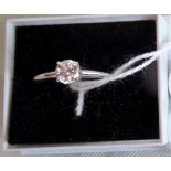 A single stone brilliant cut diamond ring in simple raised claw mount,