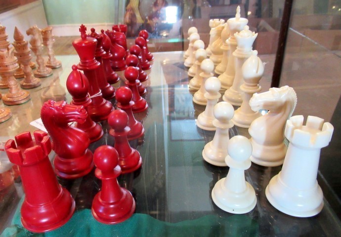 A set of white and red resin moulded chessmen.