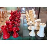 A set of white and red resin moulded chessmen.