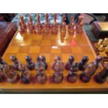 A set of over-sized amboyna and boxwood chessmen of Staunton design,
