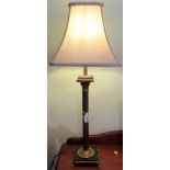 A brass Corinthian column table lamp with silk shade.