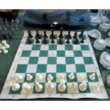 A set of white and ebonised resin moulded chessmen,