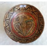 A Nishapur-type pottery circular bowl, decorated with stylized birds within a geometric border.