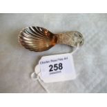 A George III silver and caddy spoon of shell form, later pierced handle,