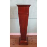 An Edwardian mahogany and boxwood strung torchere,