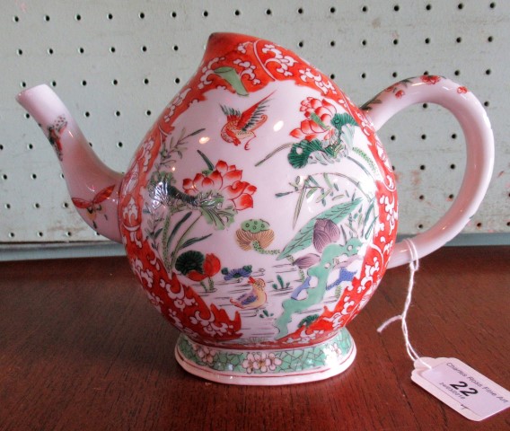 A 19th century Chinese porcelain peach form Cadogan teapot, painted in the Famille Verte palette.