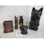 A Black Forest birch wood bear, a Scottie dog with inset glass eyes and other items.