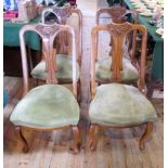 A set of four Edwardian oak dining chairs,