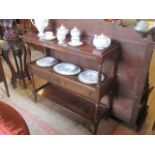 A reproduction three tier buffet, with two central drawers on turned and block supports.