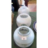 A set of three early 20th century acid frosted oil lamp diffusers.