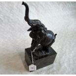 After Milo, a hollow cast bronze trumpeting elephant on veined marbled base.