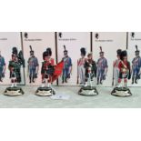 A collection of four Charles C Stadden Studio Stadden Edition cast lead military figurines from