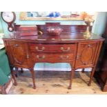 An Edwardian mahogany bow front sideboard,