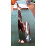 A stainless steel contemporary sculpture of sale form.