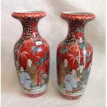 A large pair of late 19th century Japanese small vases, each decorated with figures in landscapes.